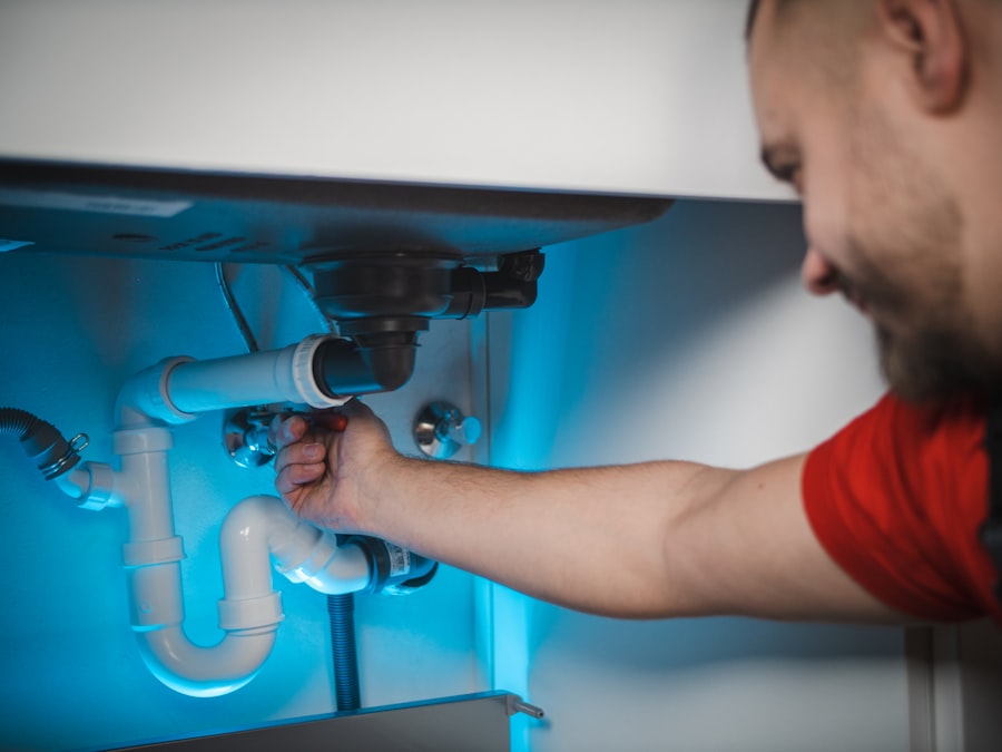 Plumber repairing a sink drain